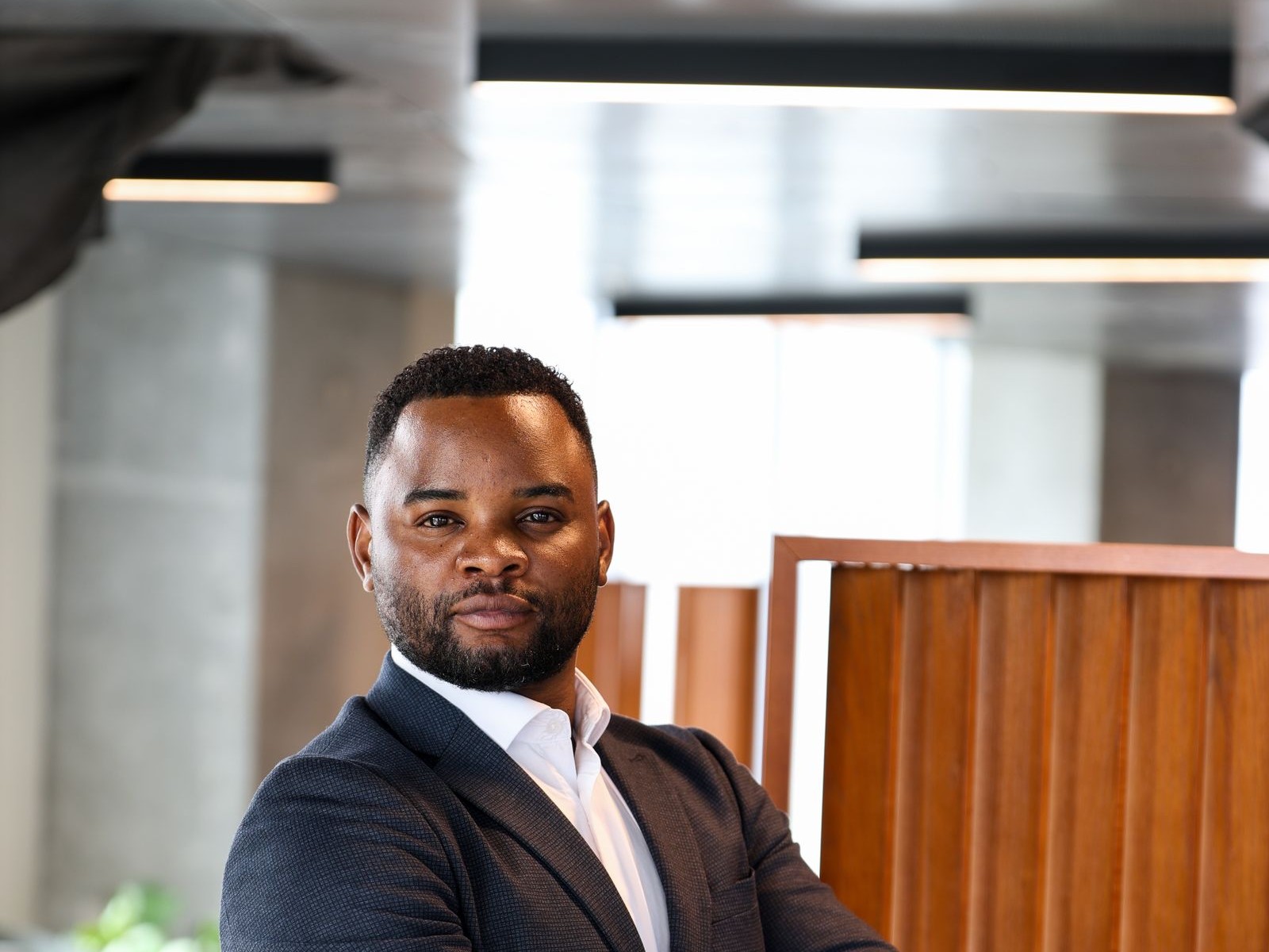 Executive portrait in a warm, tonal office setting